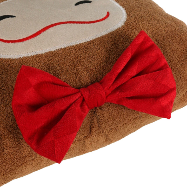 detail shot of red bow tie on highland cow cushion with velvet style patterned finish