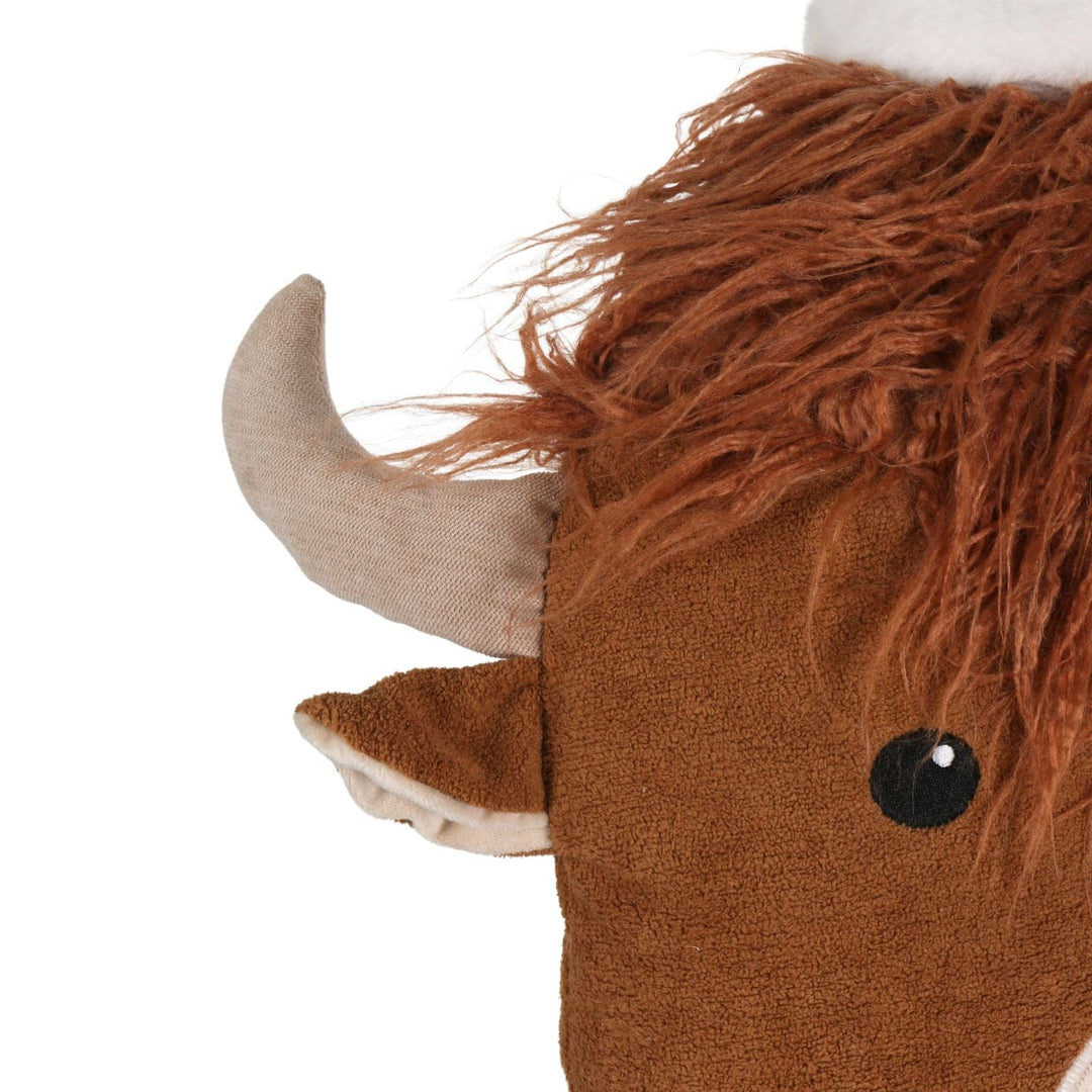 close up of highland cow cushion with horns and plush fluffy hair