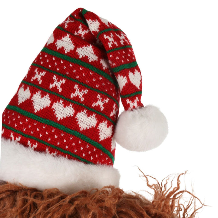 close up of highland cow santa hat with ed and green knit detail and heart patterns