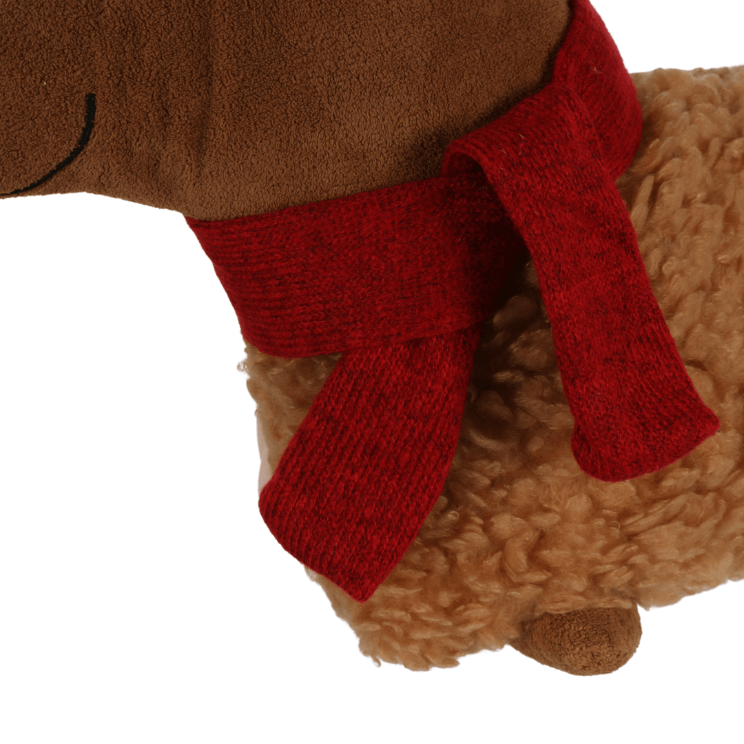 detail shot of red knitted scarf on christmas dog cushion
