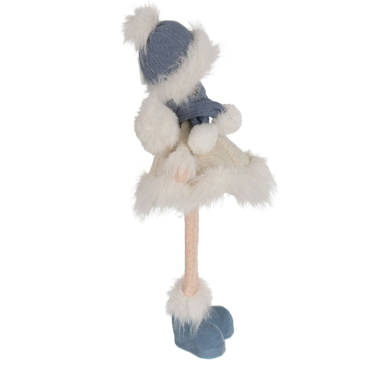 Decorative figure of a standing fairy with a blue outfit and white fur on a white background