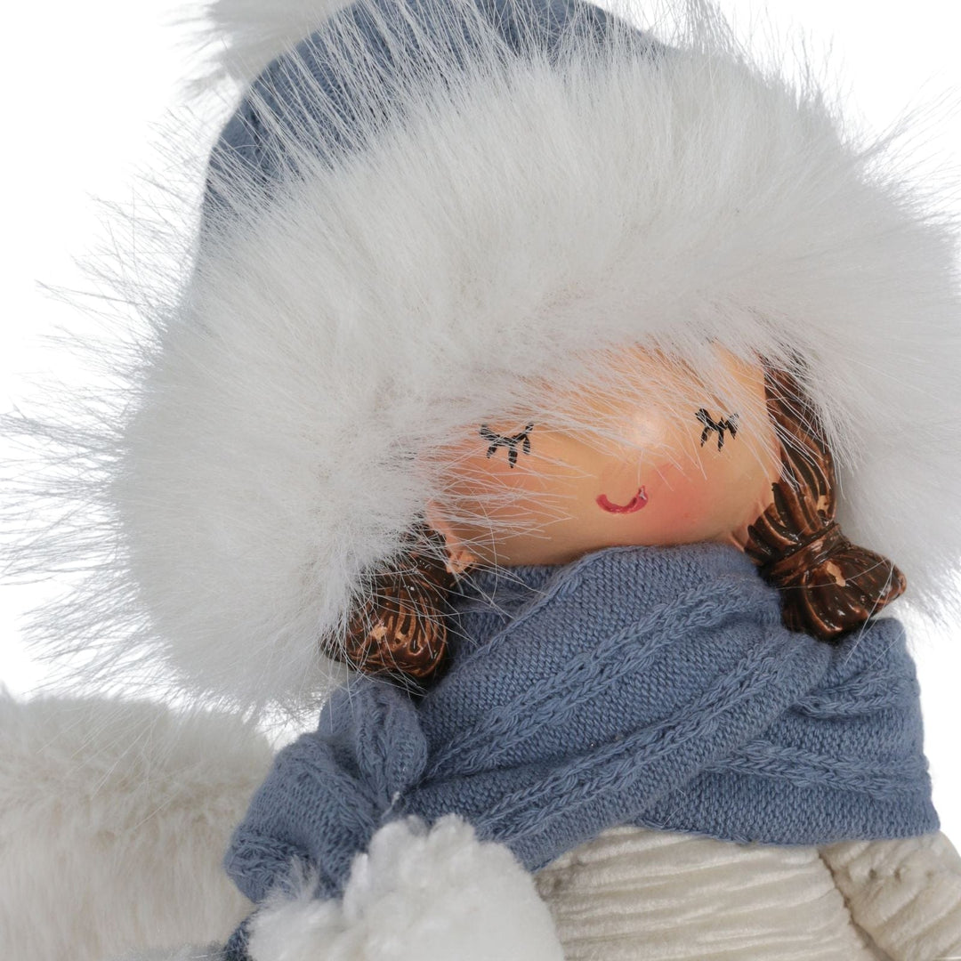 angel figure with white fur, blue scarf, and brown hair on a white background