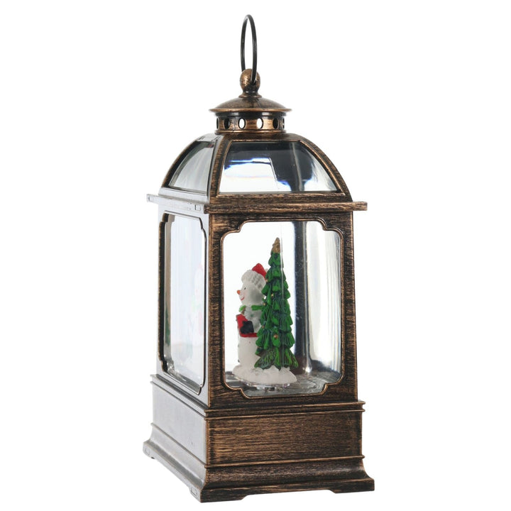 Decorative lantern with a snowman and tree inside on a white background