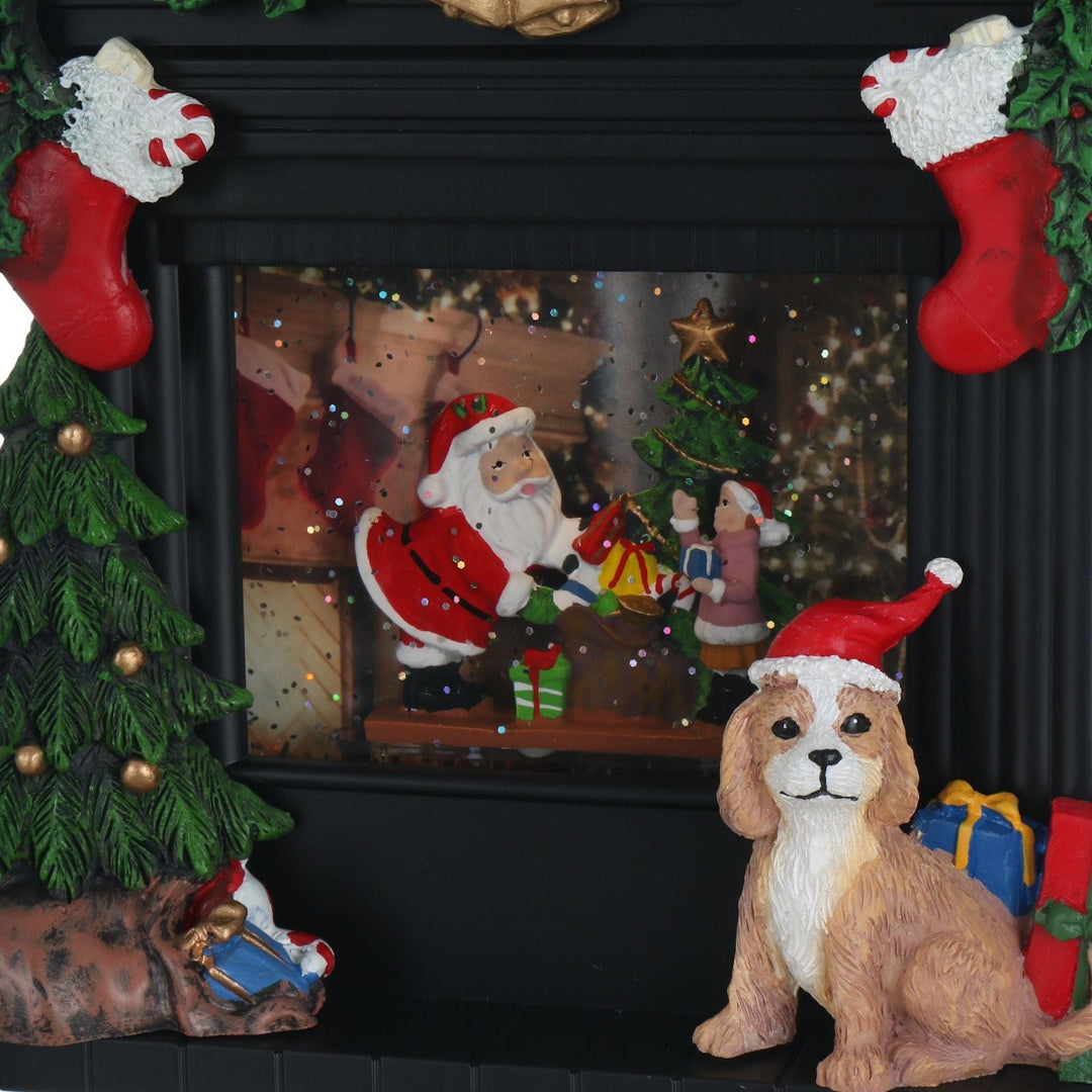Decorative scene with Santa Claus, dog, Christmas tree, and stockings inside of a fireplace.