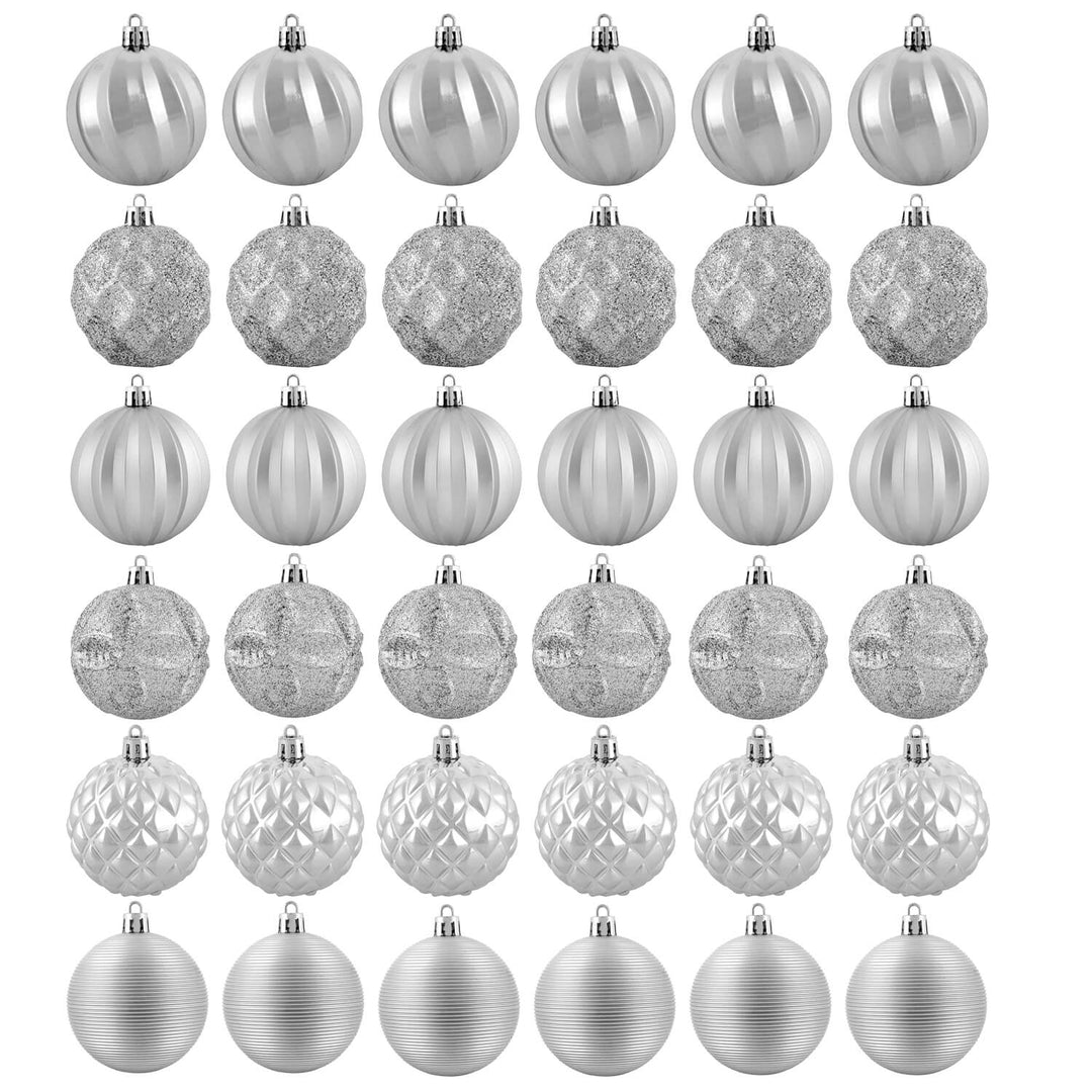Set of thirty six silver Christmas tree baubles in various designs
