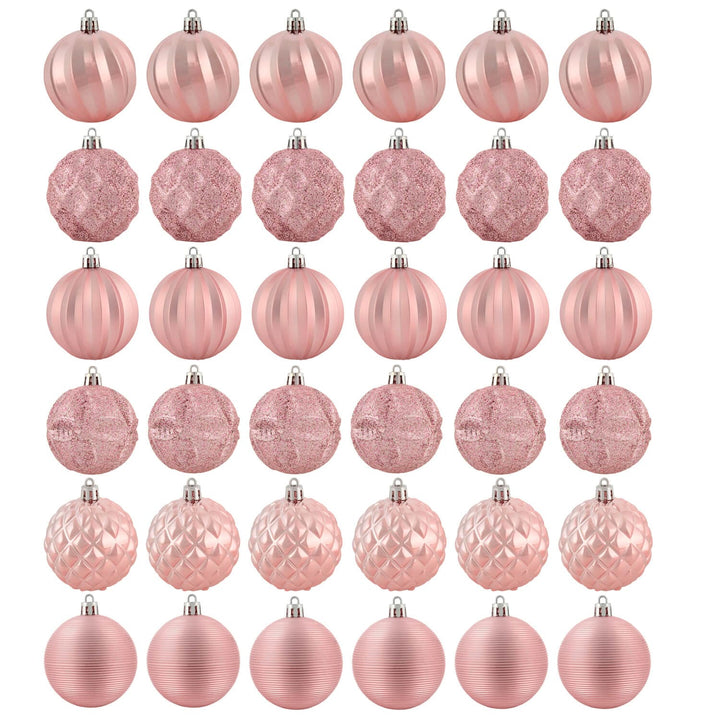 Set of thirty six pink Christmas tree baubles in various designs