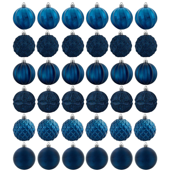 Set of thirty six navy blue Christmas tree baubles in various designs