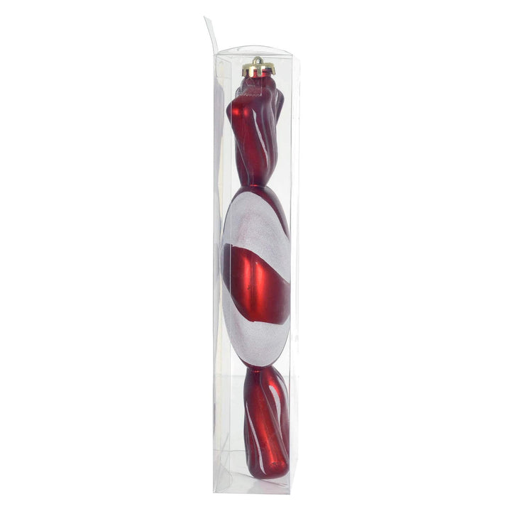 Side view of a large red and white sweet shaped Christmas tree decoration