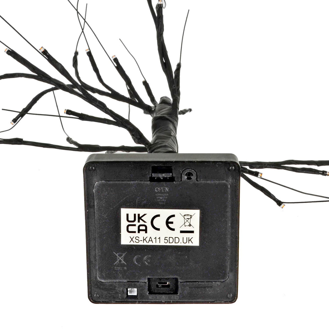 Battery compartment on the base of a black twig tree