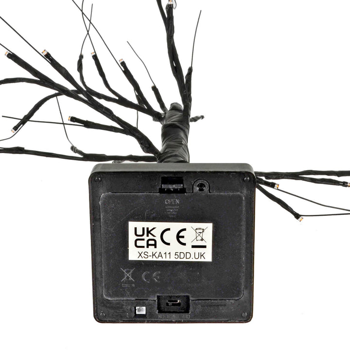 Battery compartment on the base of a black twig tree