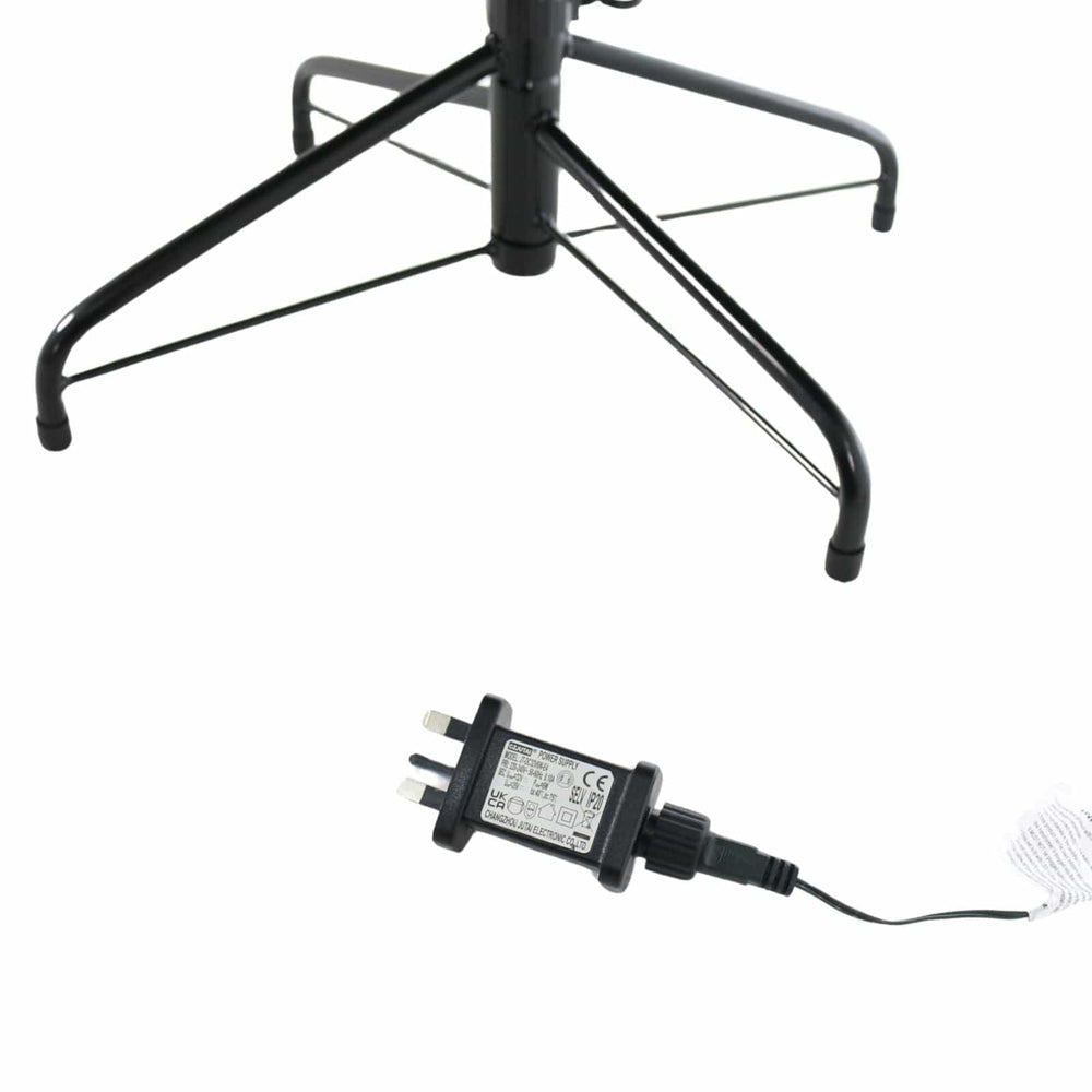 Black electrical adapter with plug on a white background