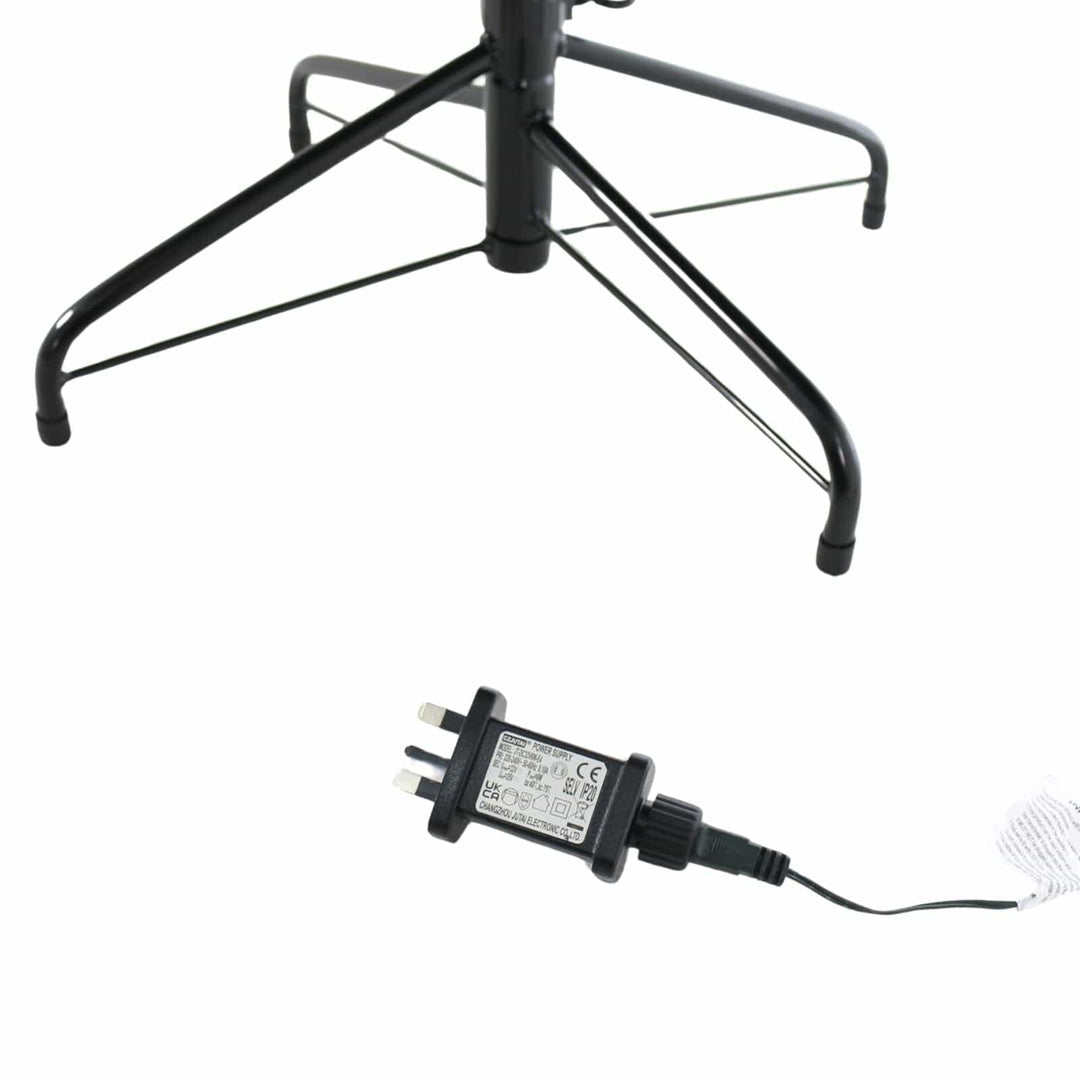 Black electrical adapter with plug on a white background