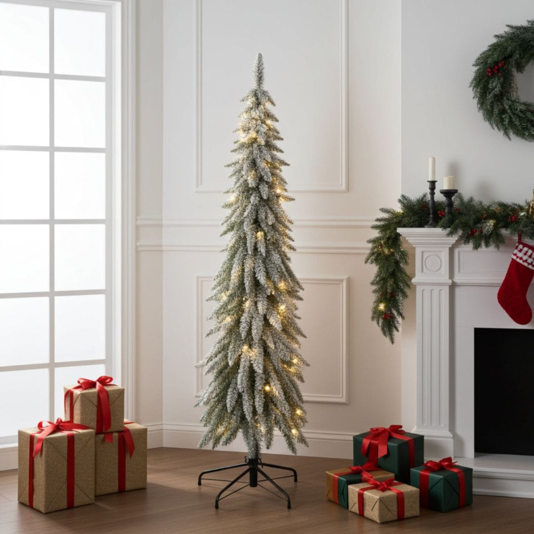 Decorative Christmas tree with lights in a room with presents and a fireplace.