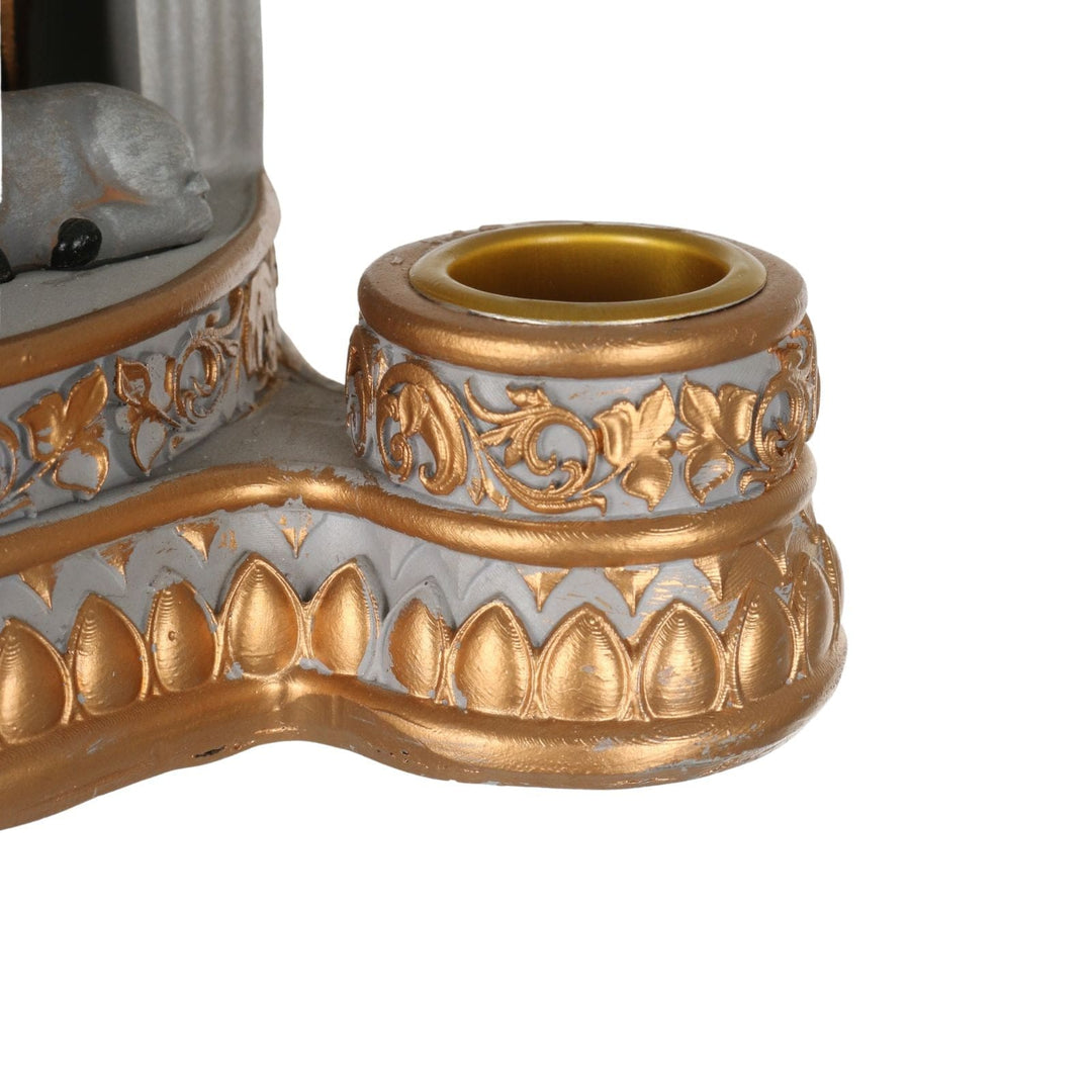 detail shot of candle stick holder with gold colour finish