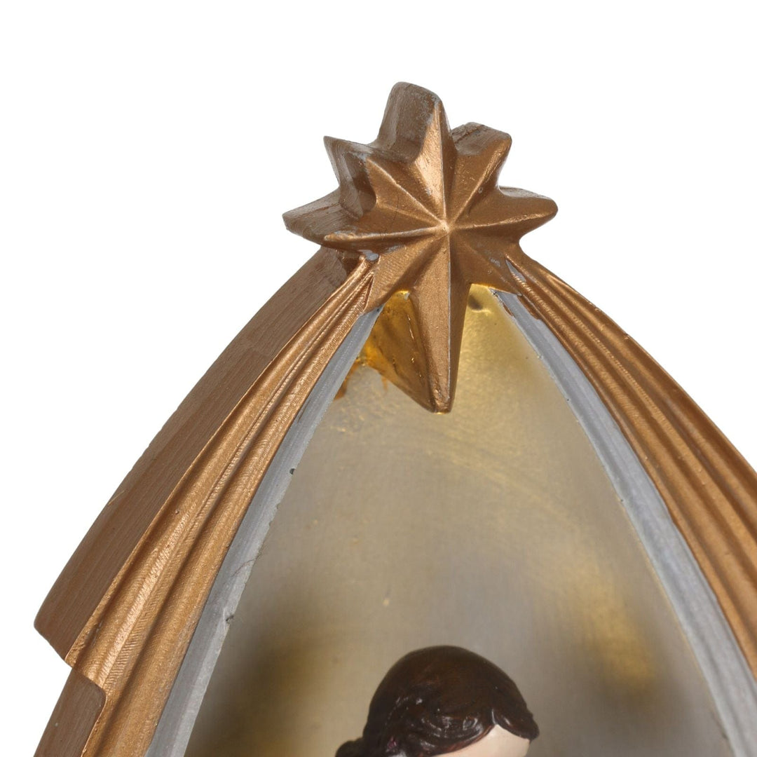 detail shot of bethlehem star at top of nativity scene decoration