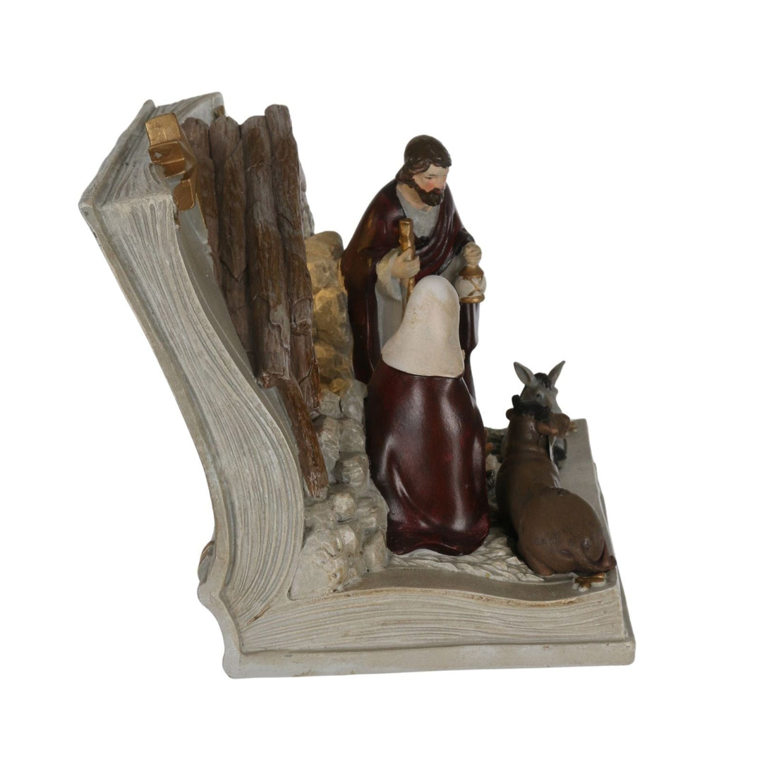 side view of open book nativity ornament with realistic resin pages