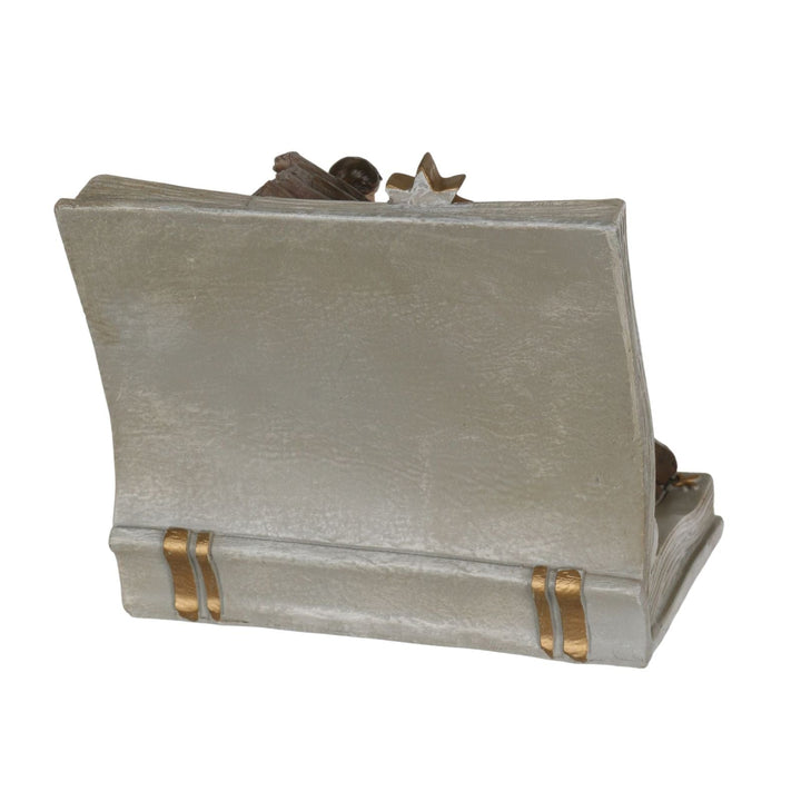 back view of book nativity ornament with gold detailing along spine