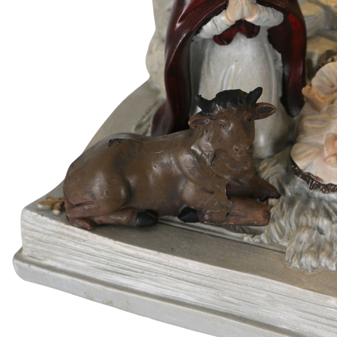 detail shot of resin cow in nativity scene ornament