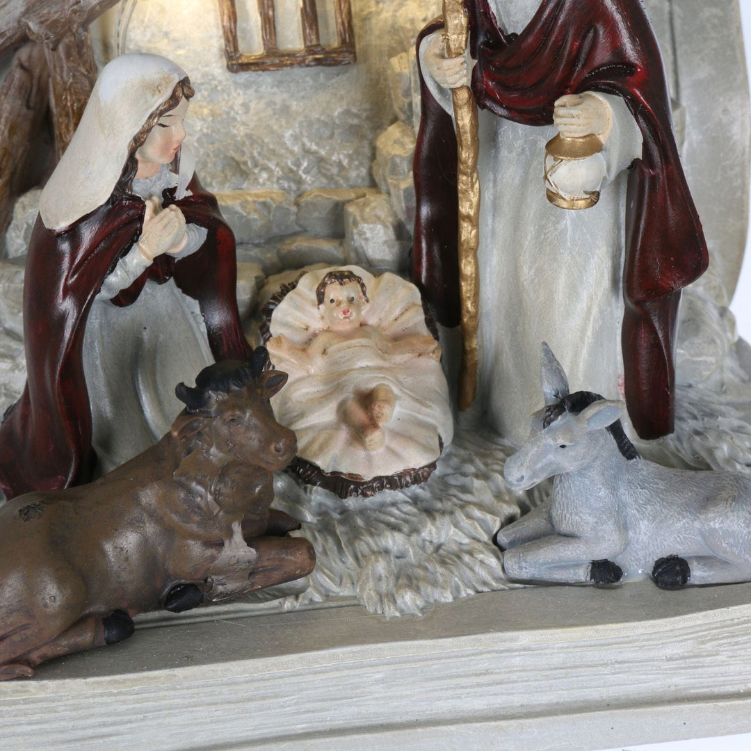 detail shot of baby jesus in manger in nativity scene ornament