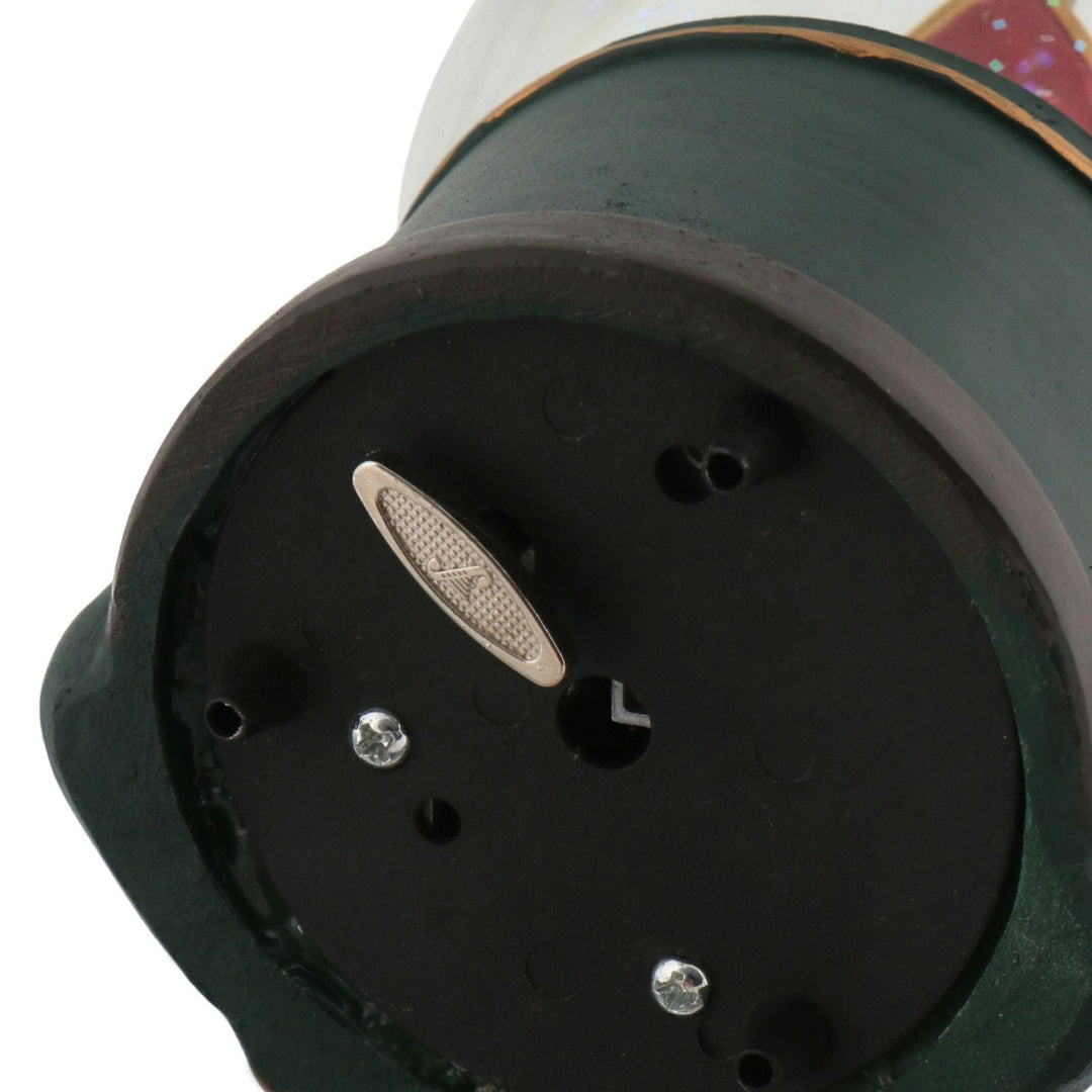 Close-up of a mechanical component with a muscail note logo on a white background