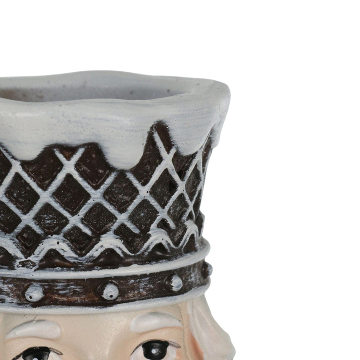 close up of nutcracker hat with space for tapered candle
