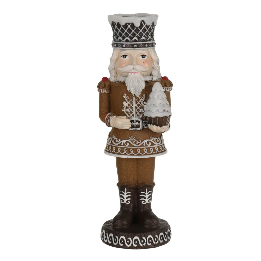 Decorative figure of a nutcracker with a crown on a white background