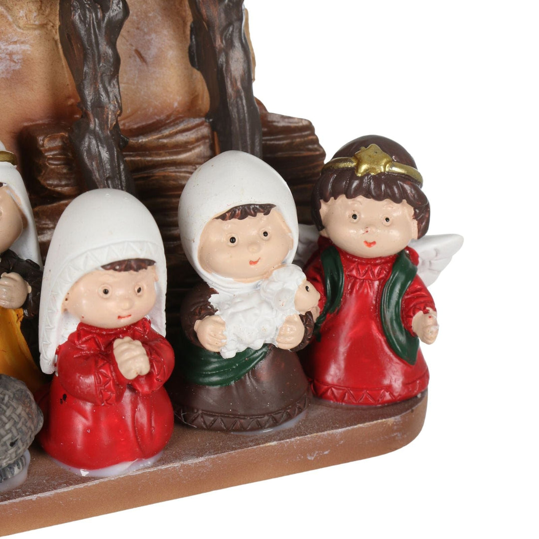 detail shot of kids in nativity scene holding little sheep
