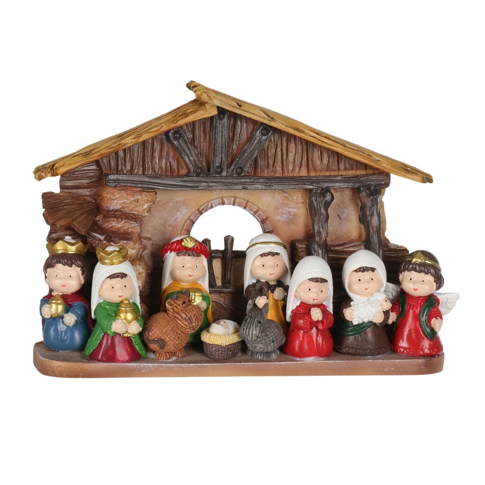 Nativity scene figurine set with stable on a white background
