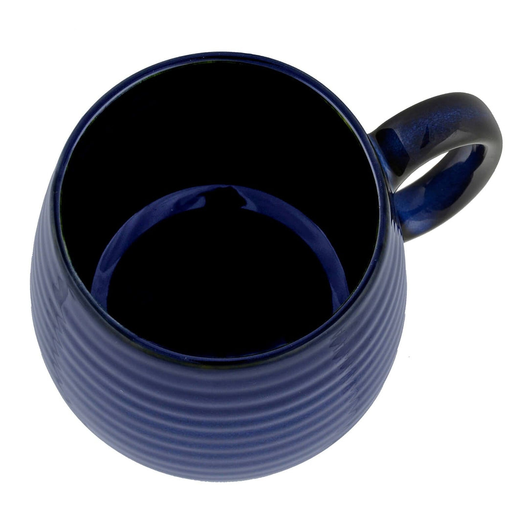 Overhead view of a dark blue coffee mug
