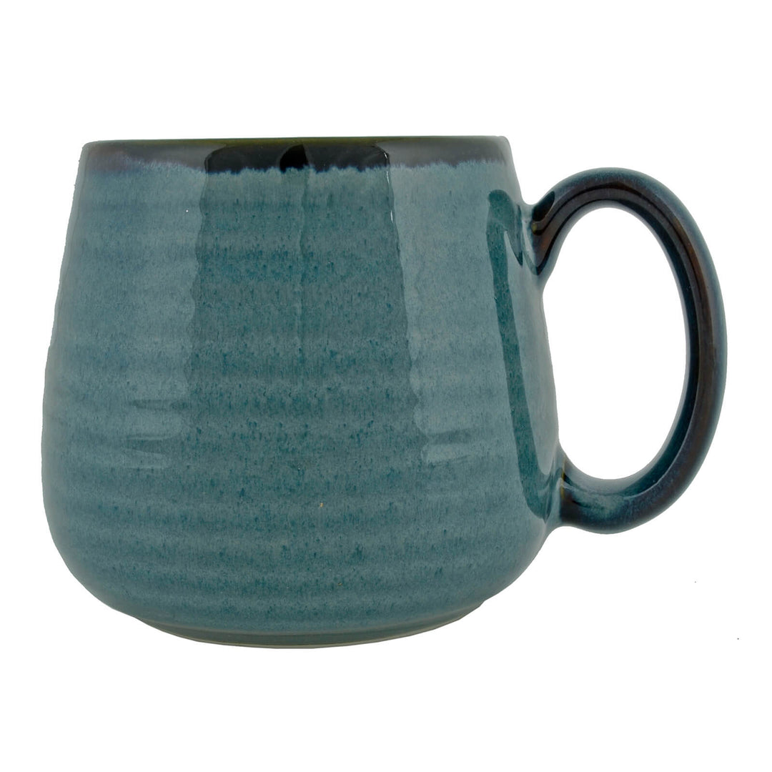 Profile of a sea green coffee mug with large handle and ribbed design
