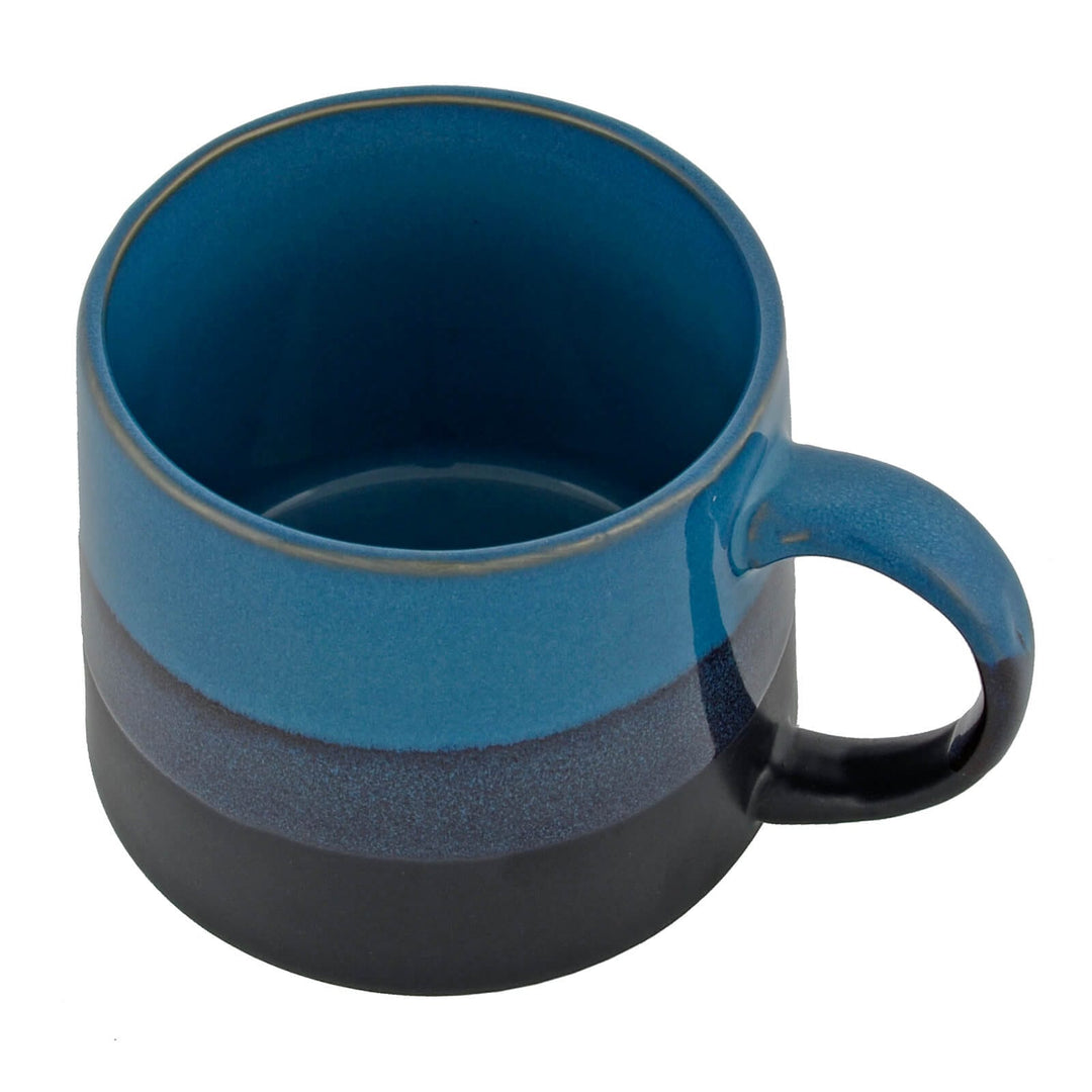 Overhead view of a blue striped coffee mug