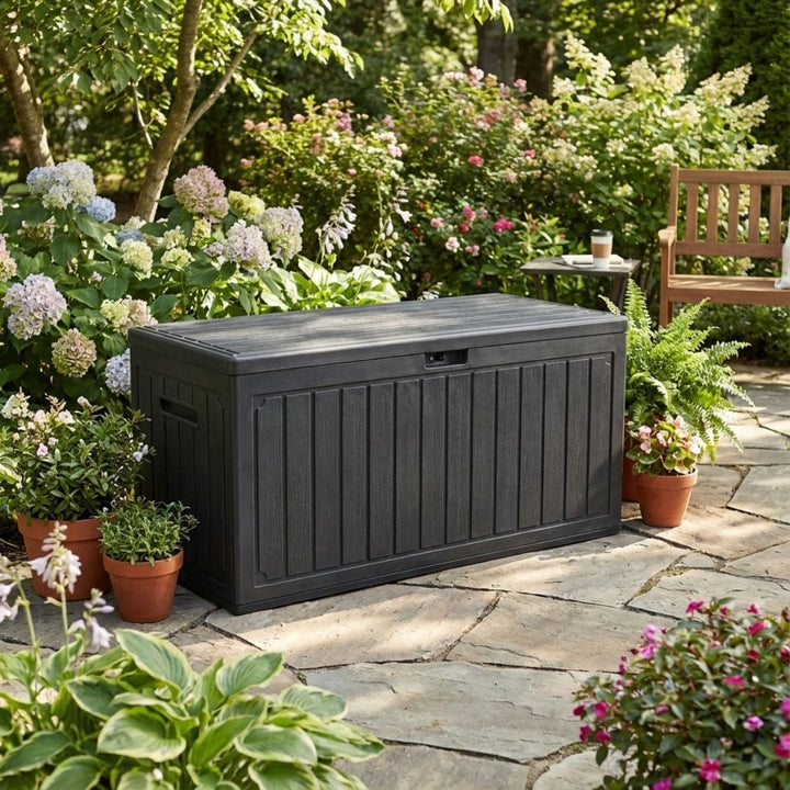 wood effect deck box in garden space with wooden bench in background