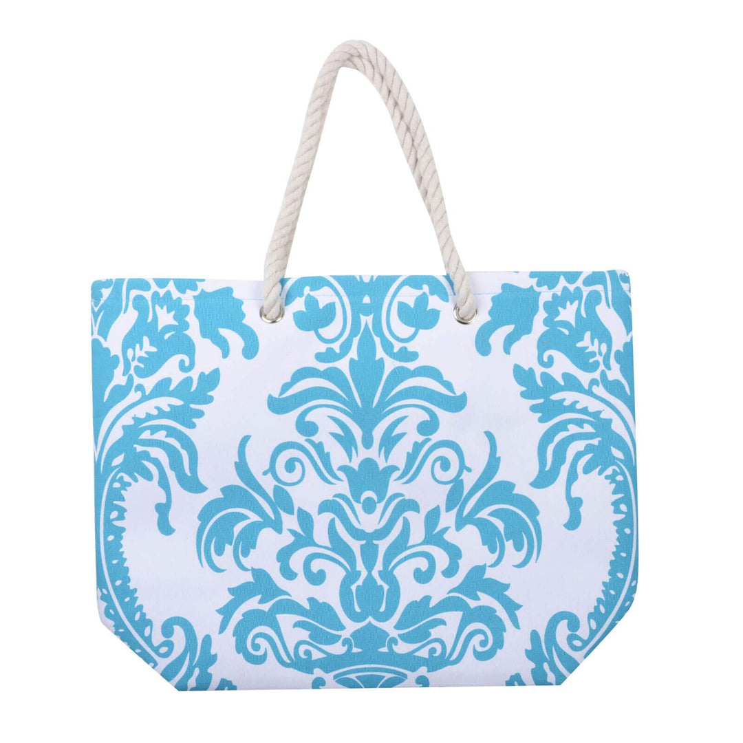 Turquoise blue floral beach bag with white rope handles on a white background