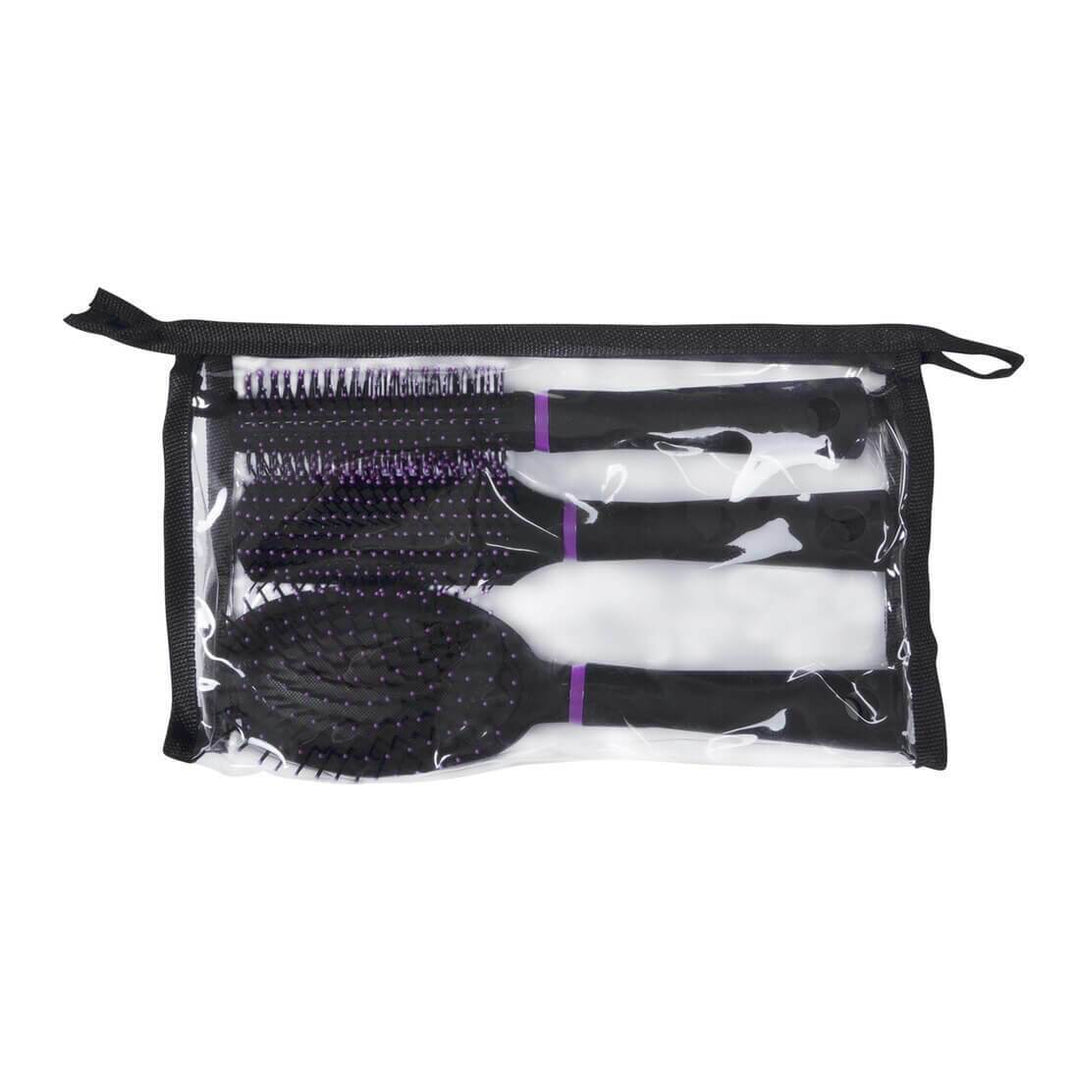 Set of hairbrushes in a clear pouch with a black zipper on a white background
