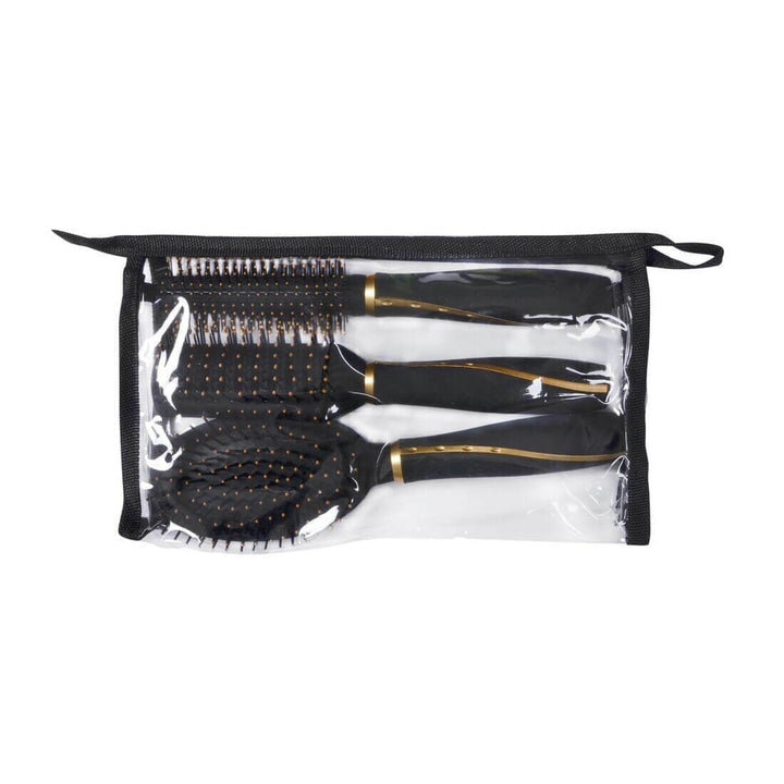 Set of black hairbrushes with gold accents in a clear pouch on a white background