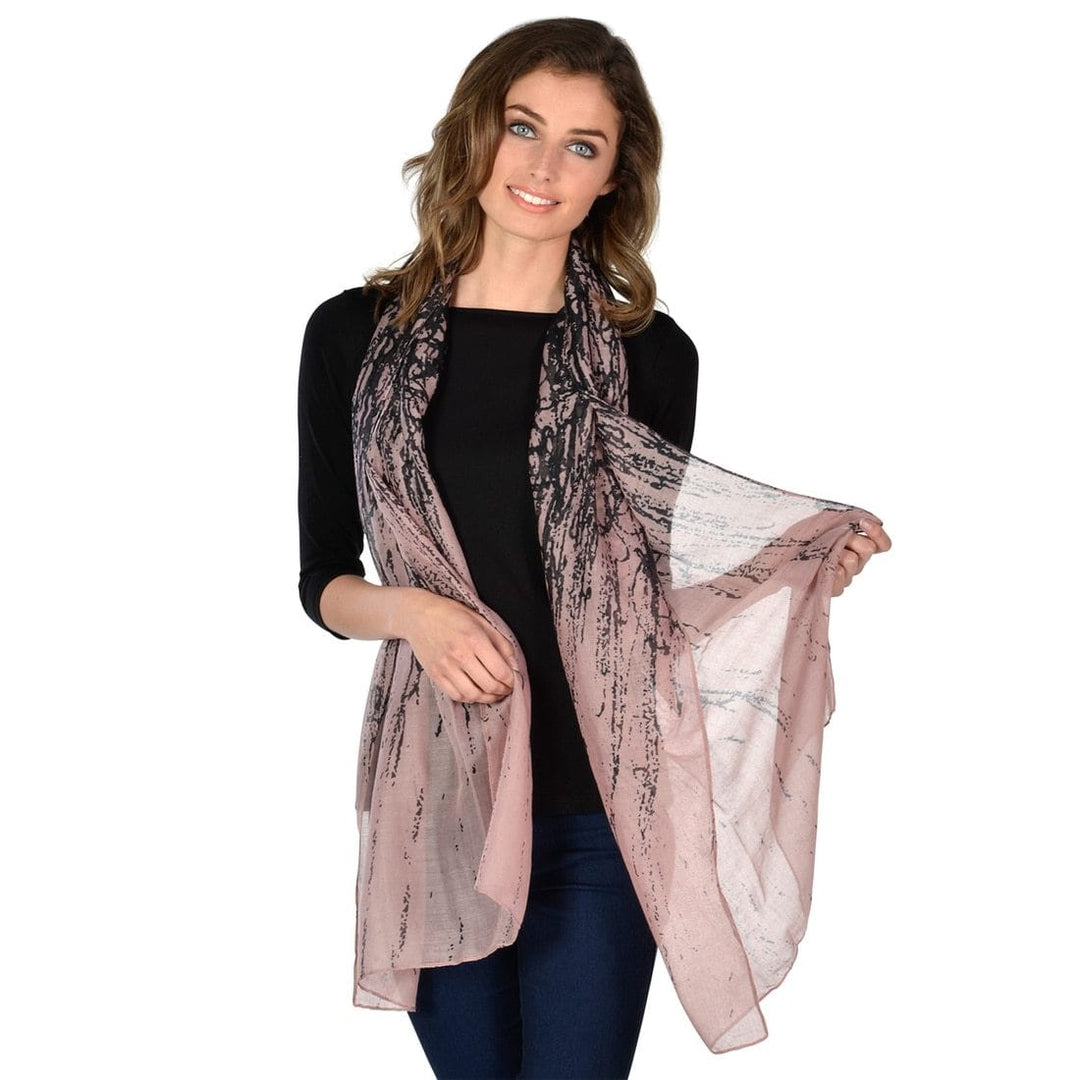 women wearing a pink sheer abstract scarf on white background